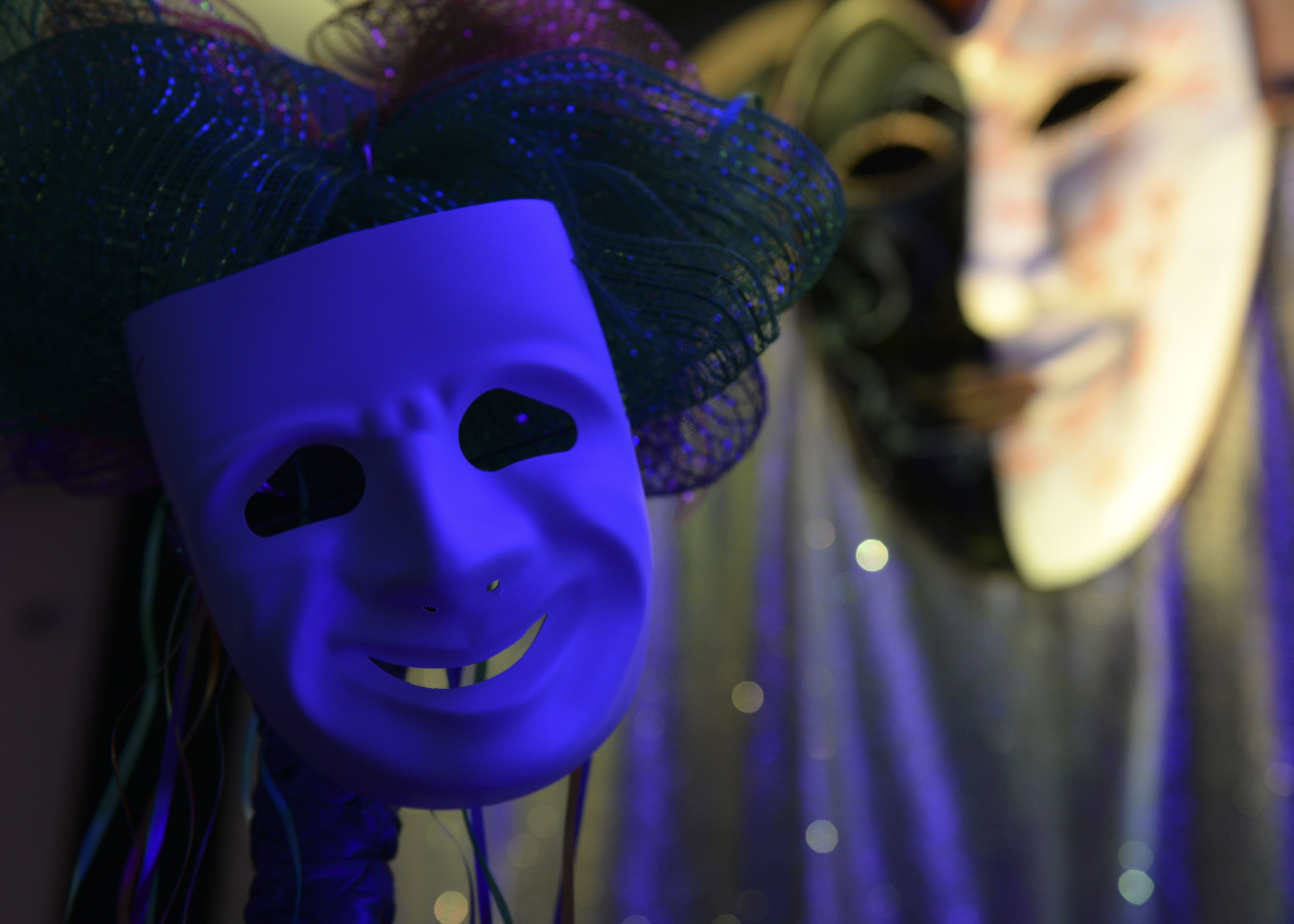 Masks and other decorations sit on display during the Mardi Gras celebration hosted by the 633rd Force Support Squadron in the Fort Eustis Club at Joint Base Langley-Eustis, Va., Feb. 9, 2018. Creative masks displaying dramatic expressions have been part of the Louisiana tradition since 1827. (U.S. Air Force photo by Airman 1st Class Monica Roybal)